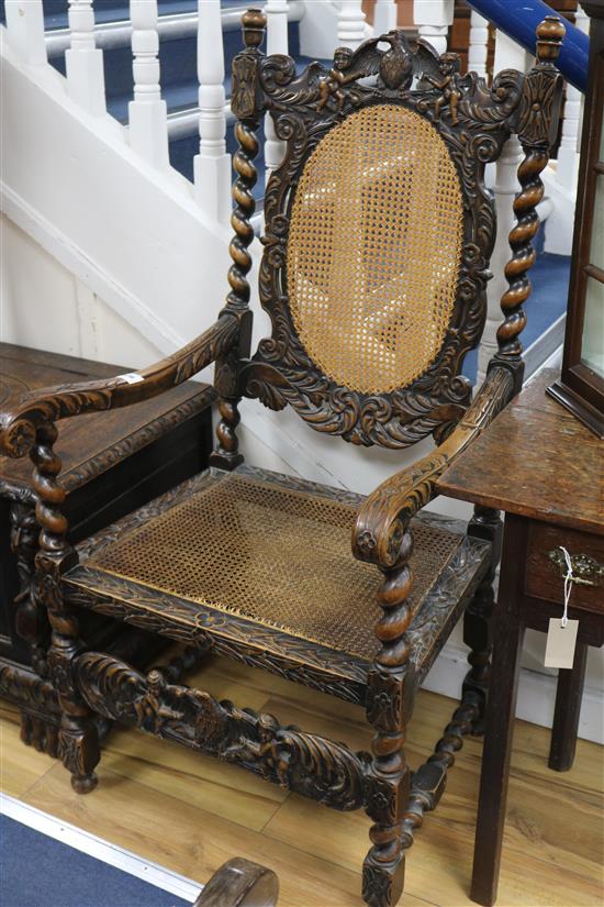 A Carolean style carved walnut caned seat and back elbow chair